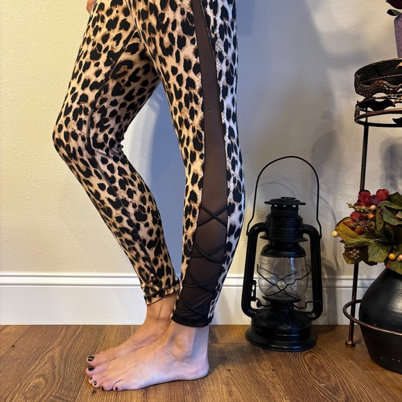 Victoria's Secret Pants - Victoria’s Secret Leopard Print Stretch Leggings w/ Mesh Side and Lace Up Detail